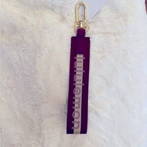 NWT lululemon athletica neverlost keychain Burgundy with bone logo,Gold Hardware